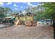 Community playground area with wooden structures and swings providing a fun and safe play area at 4213 Schooner Ne Ct, Roswell, GA 30075