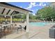 Outdoor pool area featuring a large pool with plenty of lounge seating and covered picnic area at 4213 Schooner Ne Ct, Roswell, GA 30075