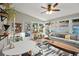 Bright sunroom with tiled floors, lots of plants and natural light at 4213 Schooner Ne Ct, Roswell, GA 30075