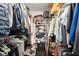 Organized walk-in closet providing ample storage solutions for all your wardrobe needs at 4213 Schooner Ne Ct, Roswell, GA 30075