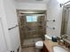 This bathroom has a large shower, vanity sink, and storage shelves at 7260 Dunhill Ter, Atlanta, GA 30328