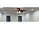 This bedroom features a ceiling fan and two windows that provide natural light at 7260 Dunhill Ter, Atlanta, GA 30328