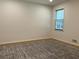 Bedroom with hardwood flooring, natural light, and a large window at 7260 Dunhill Ter, Atlanta, GA 30328