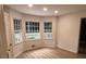 Cozy breakfast nook with large windows and light wood floors at 7260 Dunhill Ter, Atlanta, GA 30328