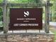 Sandy Springs, Georgia, Lost Corner Preserve neighborhood sign with stone base at 7300 street number at 7260 Dunhill Ter, Atlanta, GA 30328