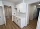 Bright kitchen features white cabinets and granite countertop at 7260 Dunhill Ter, Atlanta, GA 30328