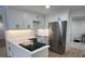 Modern kitchen with white cabinets, stainless steel appliances, and quartz countertops at 7260 Dunhill Ter, Atlanta, GA 30328