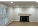 Living room featuring fireplace and large window at 7260 Dunhill Ter, Atlanta, GA 30328