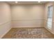 Spacious living room with clean lines, modern lighting, and a vintage-style rug at 7260 Dunhill Ter, Atlanta, GA 30328