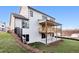 Back exterior of home featuring a large wood deck and walk out basement at 2340 Ellis Mountain Dr, Marietta, GA 30064