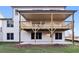 Back exterior of home featuring a large wood deck and walk out basement at 2340 Ellis Mountain Dr, Marietta, GA 30064