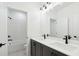 Bathroom with dual sinks, vanity with storage, and a separate room with a shower and tub at 2340 Ellis Mountain Dr, Marietta, GA 30064