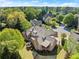 Expansive backyard with a custom pool, upper deck, stone patio, and mature trees at 3562 Langley Oaks Se Ct, Marietta, GA 30067