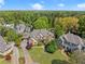 Stunning aerial view showcasing the grand home, lush greenery, and beautifully manicured lawn in a desirable neighborhood at 3562 Langley Oaks Se Ct, Marietta, GA 30067