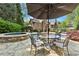 Beautiful backyard view of the property's pool, patio, and manicured landscaping from the seating area at 3562 Langley Oaks Se Ct, Marietta, GA 30067