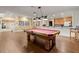 Finished basement features a pool table, a bar area, and a doorway leading to an exercise area at 3562 Langley Oaks Se Ct, Marietta, GA 30067