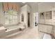 Luxurious bathroom with a soaking tub, shower, and vanity with storage at 3562 Langley Oaks Se Ct, Marietta, GA 30067