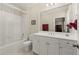 Clean bathroom featuring a white vanity, large mirror, and a shower-tub combo at 3562 Langley Oaks Se Ct, Marietta, GA 30067