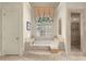 Luxurious bathroom featuring a soaking tub, arched window, and separate shower at 3562 Langley Oaks Se Ct, Marietta, GA 30067