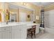 Well-lit bathroom with a spacious vanity, sink, and built-in toilet at 3562 Langley Oaks Se Ct, Marietta, GA 30067