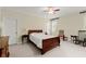 Comfortable bedroom with traditional furnishings, neutral carpet, ceiling fan, and natural light at 3562 Langley Oaks Se Ct, Marietta, GA 30067