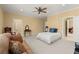 Large bedroom featuring a neutral palette, a seating area, and multiple entryways at 3562 Langley Oaks Se Ct, Marietta, GA 30067