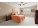 Bright bedroom showcasing carpet, a warm color scheme, and classic furniture at 3562 Langley Oaks Se Ct, Marietta, GA 30067