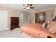 Spacious bedroom featuring traditional furnishings, plush carpet, and natural light at 3562 Langley Oaks Se Ct, Marietta, GA 30067