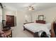 Neutral bedroom featuring a cozy bed, hardwood furniture, and soft natural light at 3562 Langley Oaks Se Ct, Marietta, GA 30067