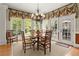 Bright breakfast nook with a bay window, chandelier, and access to the outdoor deck at 3562 Langley Oaks Se Ct, Marietta, GA 30067