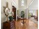 Elegant foyer with hardwood floors, decorative mirror, and a view into the formal dining room at 3562 Langley Oaks Se Ct, Marietta, GA 30067