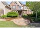 Beautifully landscaped front yard featuring a stone walkway leading to the grand entrance of the home at 3562 Langley Oaks Se Ct, Marietta, GA 30067