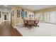 Spacious game room with a round table, patterned chairs, and french doors to the exterior at 3562 Langley Oaks Se Ct, Marietta, GA 30067