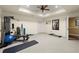 Home gym featuring exercise equipment, a ceiling fan, and neutral-colored walls at 3562 Langley Oaks Se Ct, Marietta, GA 30067