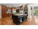 Open kitchen with large island, stainless appliances, and custom cabinetry at 3562 Langley Oaks Se Ct, Marietta, GA 30067