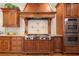 Charming kitchen features custom wood cabinetry, granite countertops, and a stainless steel range at 3562 Langley Oaks Se Ct, Marietta, GA 30067