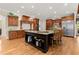Spacious kitchen featuring an island, breakfast bar, and wooden cabinets at 3562 Langley Oaks Se Ct, Marietta, GA 30067