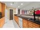 Basement kitchenette features wooden cabinets, granite countertops, and stainless steel appliances at 3562 Langley Oaks Se Ct, Marietta, GA 30067