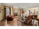 Living room with a stone fireplace, hardwood flooring, a leather couch, and lots of natural light at 3562 Langley Oaks Se Ct, Marietta, GA 30067