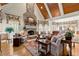 Spacious living room features a stone fireplace, wood-paneled ceiling, and hardwood floors at 3562 Langley Oaks Se Ct, Marietta, GA 30067