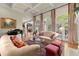 Bright living room with decorative fireplace, hardwood floors, and lots of natural light at 3562 Langley Oaks Se Ct, Marietta, GA 30067