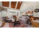 Open-concept living space with vaulted ceilings and hardwood floors leads to dining and kitchen at 3562 Langley Oaks Se Ct, Marietta, GA 30067