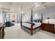 Spacious main bedroom with a four-poster bed, sitting area, and coffered ceilings at 3562 Langley Oaks Se Ct, Marietta, GA 30067