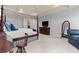 Large main bedroom with a four-poster bed, TV, and elegant furnishings at 3562 Langley Oaks Se Ct, Marietta, GA 30067