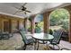 A covered patio featuring brick archways that open to a view of manicured backyard landscaping at 3562 Langley Oaks Se Ct, Marietta, GA 30067