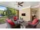 Outdoor screened porch with comfortable seating, ceiling fan, and serene views at 3562 Langley Oaks Se Ct, Marietta, GA 30067