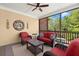 Relaxing screened porch features comfortable seating and views of the surrounding landscape at 3562 Langley Oaks Se Ct, Marietta, GA 30067