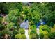 Aerial view of the property showing mature trees and beautiful landscaping at 4694 E Glen Ridge E Cir, Winston, GA 30187