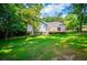 Spacious backyard with lush grass and a deck, perfect for outdoor entertaining and relaxation at 4694 E Glen Ridge E Cir, Winston, GA 30187