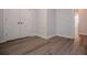 Bedroom featuring wood-look flooring, neutral paint, base molding and a closet at 4694 E Glen Ridge E Cir, Winston, GA 30187